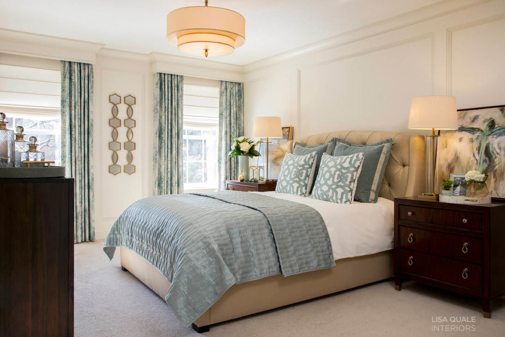 This is an example of a medium sized traditional master bedroom in Philadelphia with white walls and carpet.
