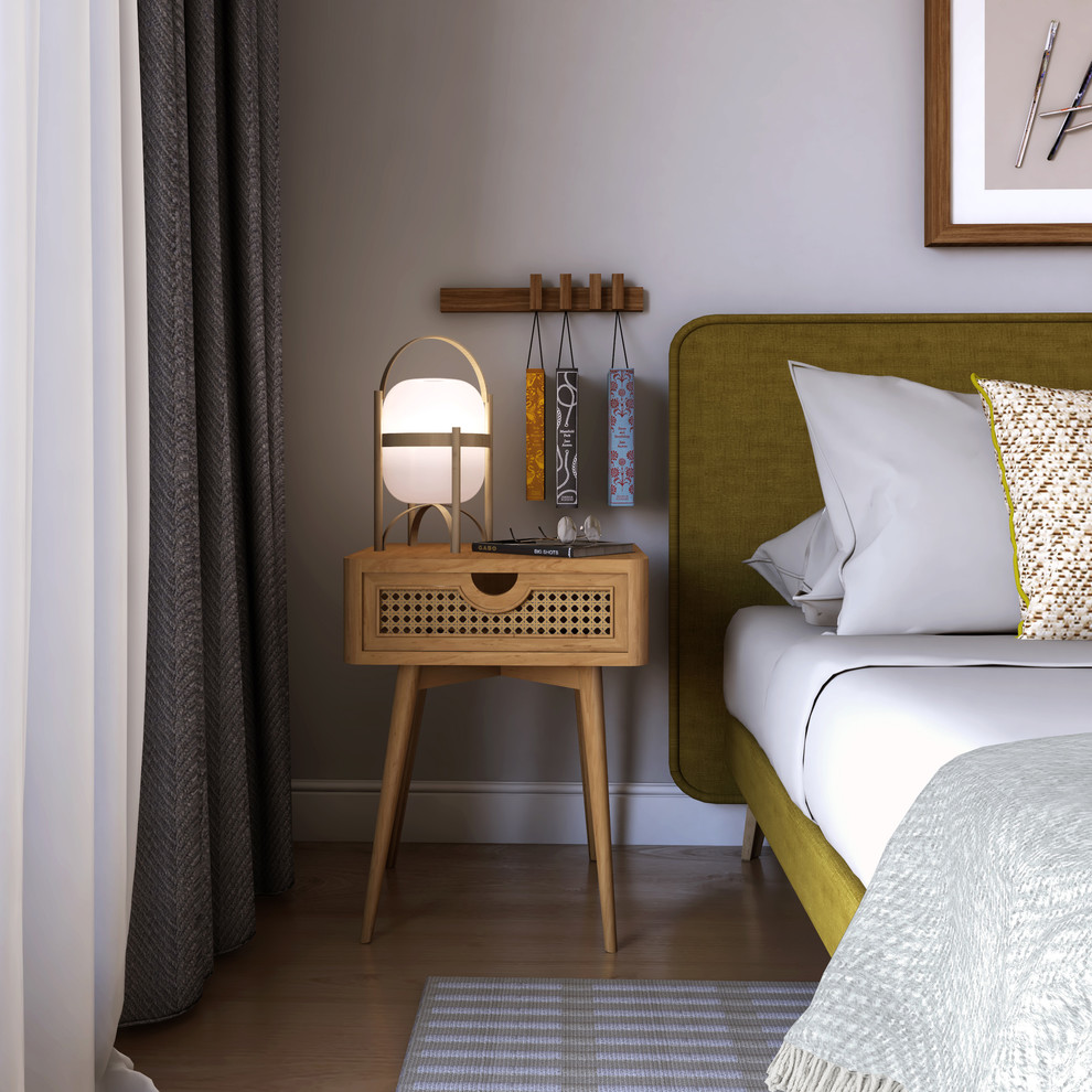 Aménagement d'une chambre d'amis moderne de taille moyenne avec un mur gris, un sol en bois brun et un sol marron.