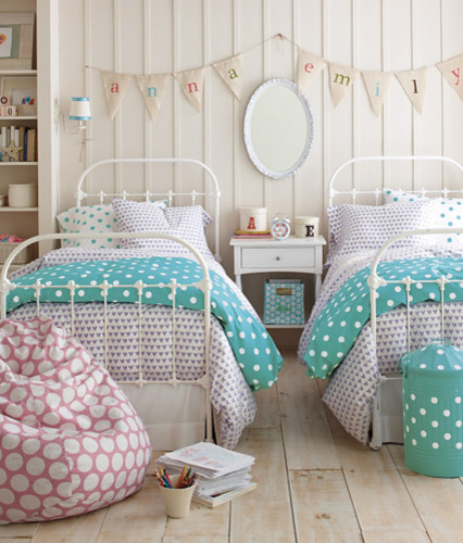 Example of a trendy light wood floor bedroom design in Burlington with white walls