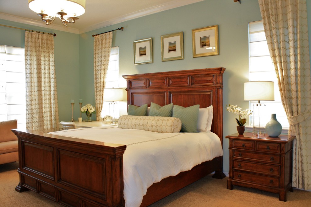 Esempio di una camera da letto contemporanea con pareti blu e moquette