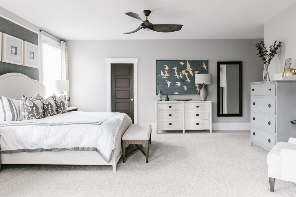Inspiration for a large traditional master bedroom in Charlotte with grey walls, carpet and white floors.