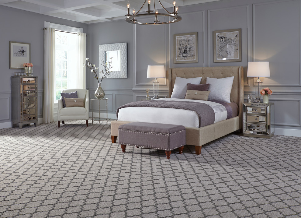 Large transitional master carpeted bedroom photo in New York with gray walls