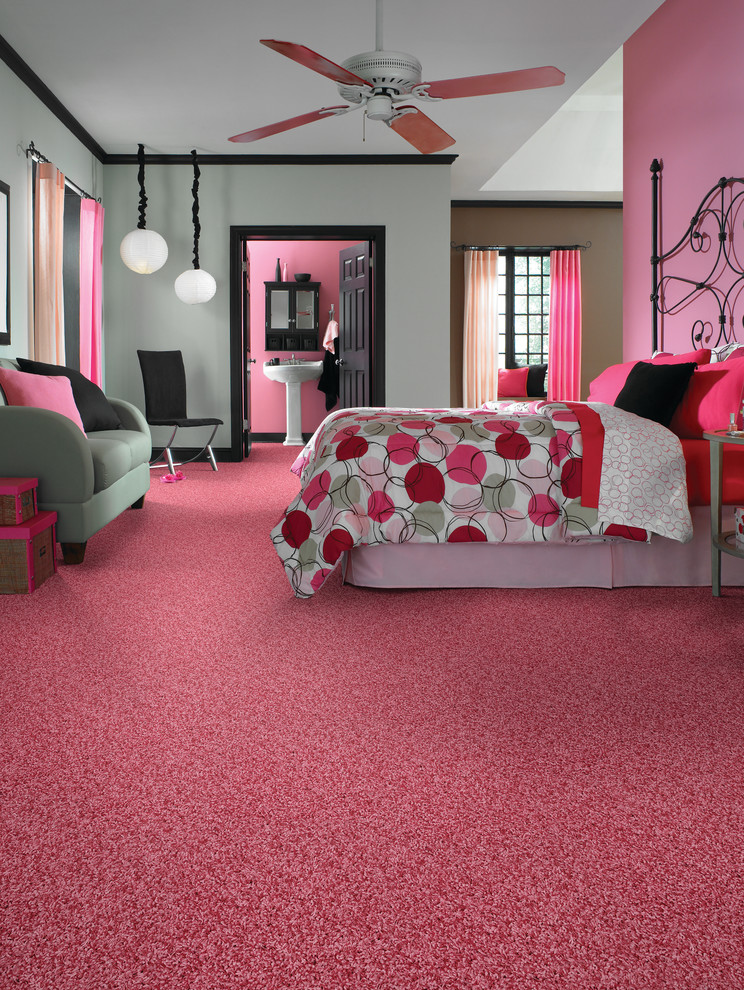Medium sized bohemian master and grey and pink bedroom in Other with pink walls, carpet, no fireplace and pink floors.
