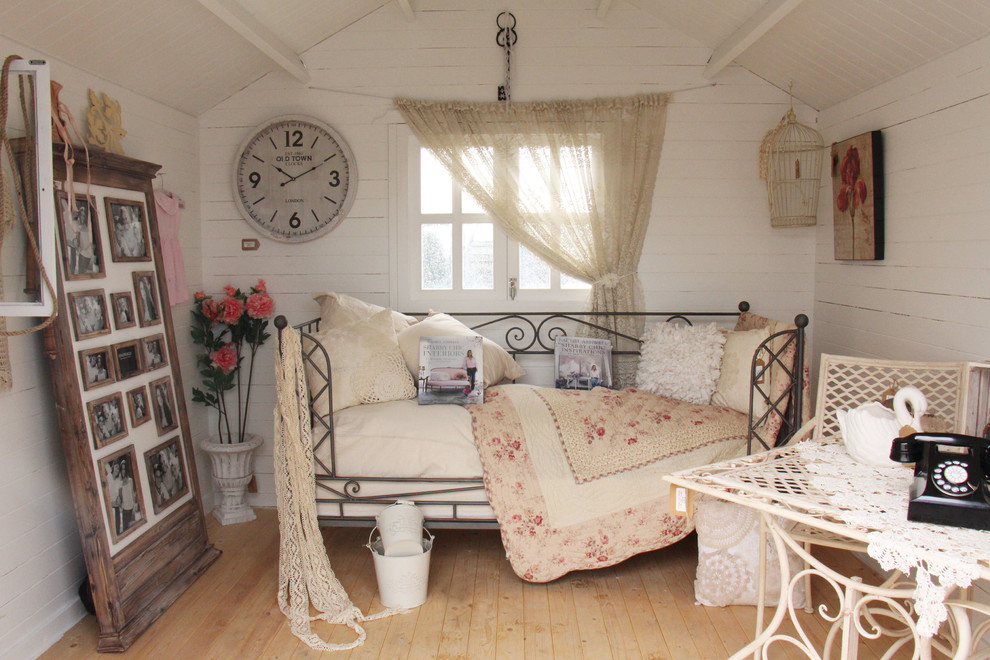 This is an example of a medium sized shabby-chic style bedroom in Sydney.