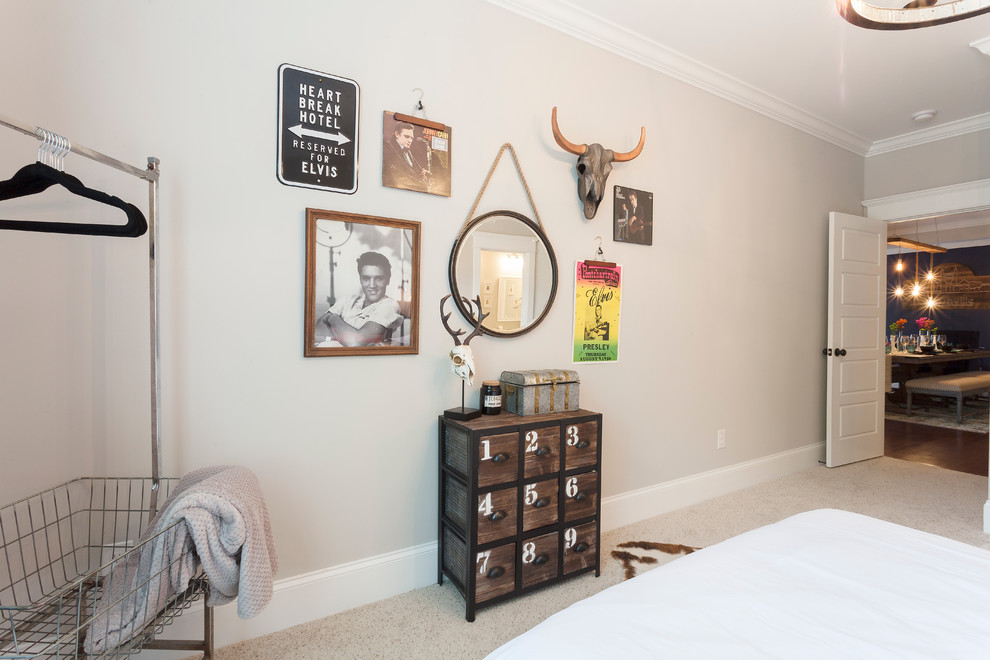 Design ideas for a medium sized bohemian guest bedroom in Nashville with beige walls and carpet.
