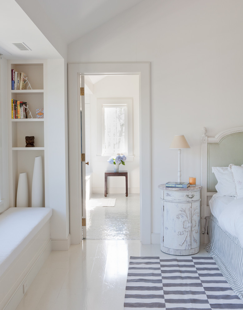 Inspiration for a coastal bedroom in New York with white floors.