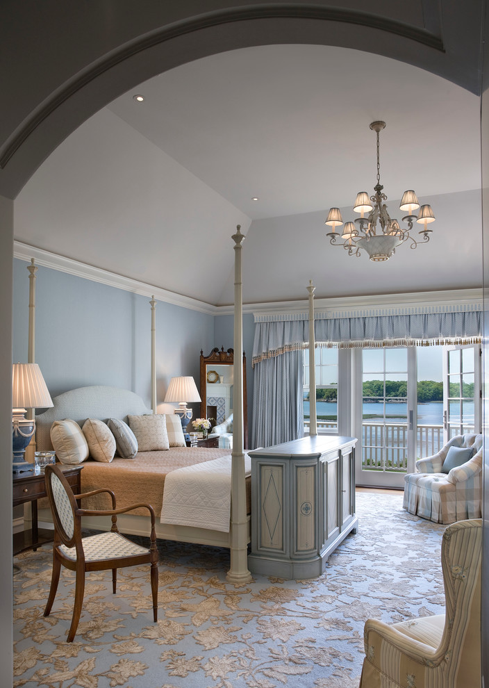 Huge ornate master carpeted bedroom photo in New York with blue walls