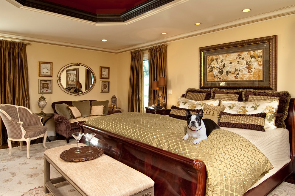 Example of a classic master dark wood floor bedroom design in New York with beige walls