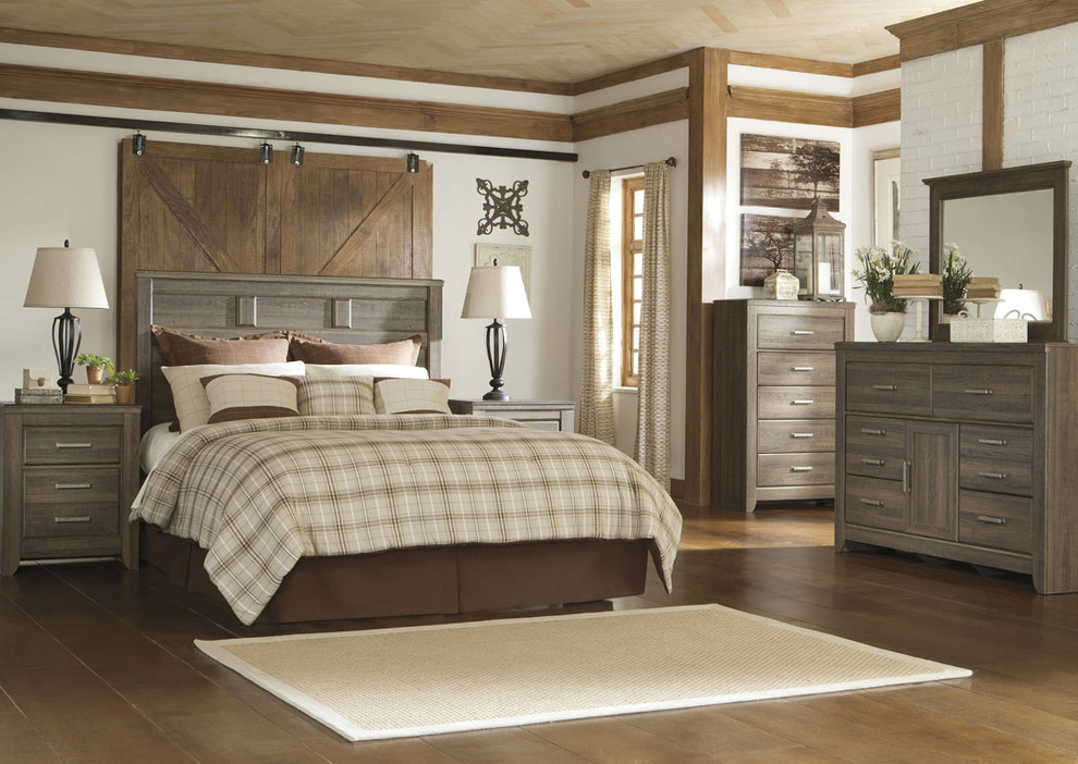 Inspiration for a large rustic master medium tone wood floor and brown floor bedroom remodel in Orlando with white walls and no fireplace
