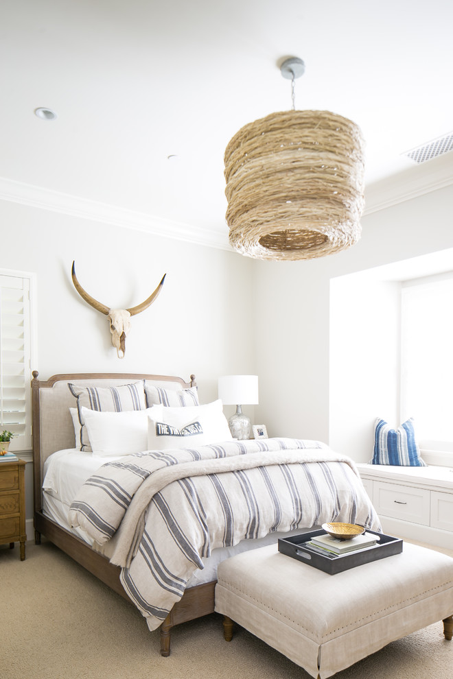 Eclectic master bedroom in Orange County with grey walls, carpet and beige floors.