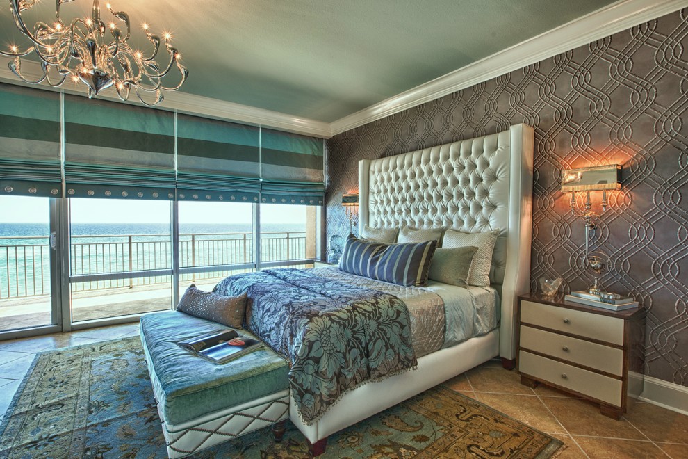 Example of a large beach style master ceramic tile bedroom design in Miami with gray walls