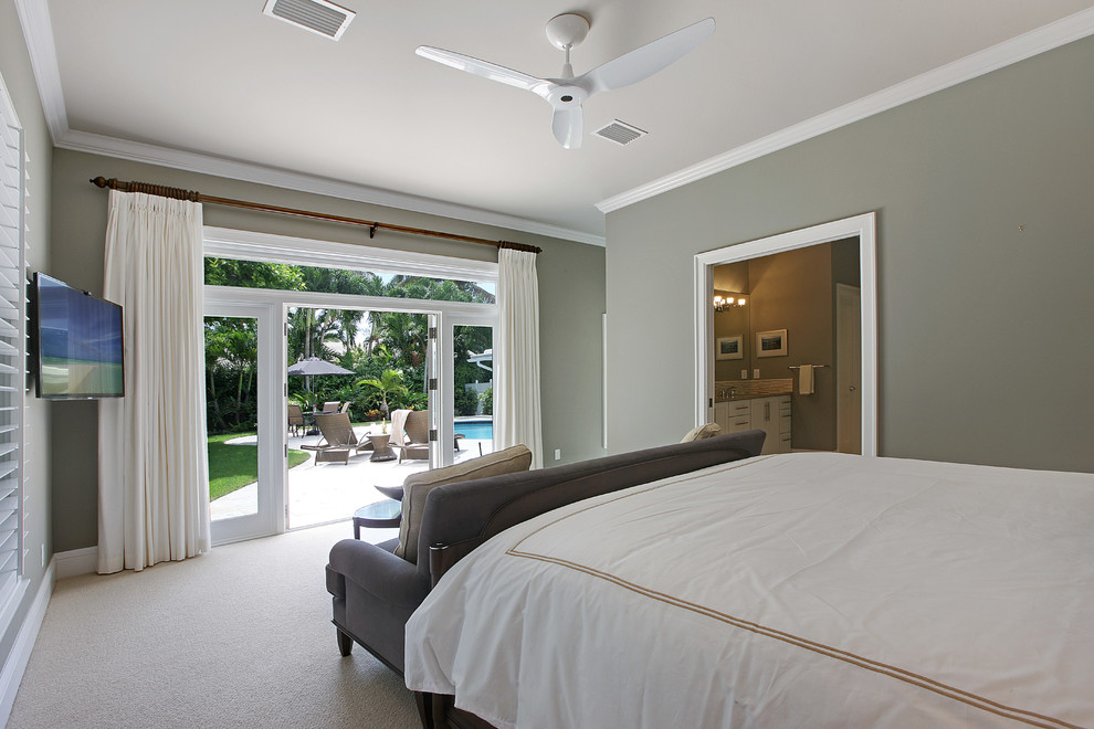 Inspiration for a large classic guest bedroom in Miami with grey walls and carpet.