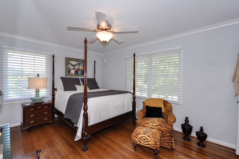 Bedroom - traditional master medium tone wood floor bedroom idea in Atlanta with gray walls