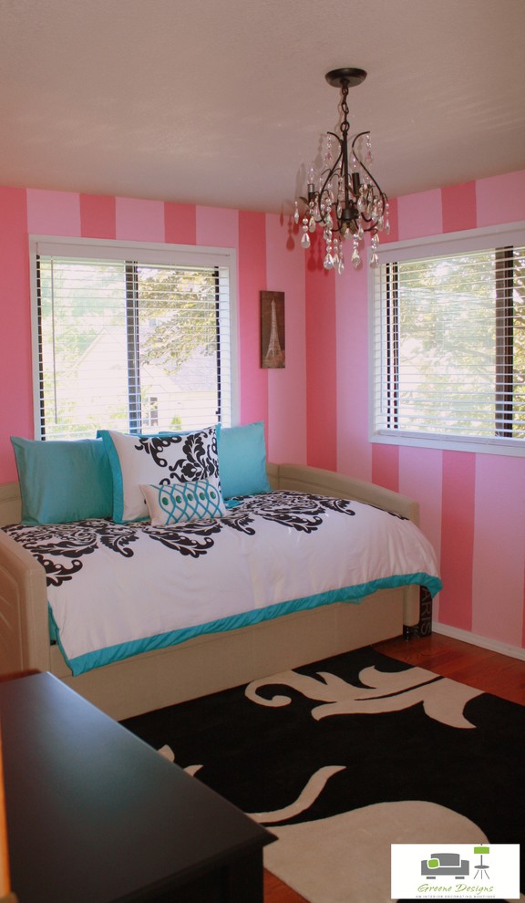Inspiration for a mid-sized timeless medium tone wood floor bedroom remodel in Seattle with pink walls