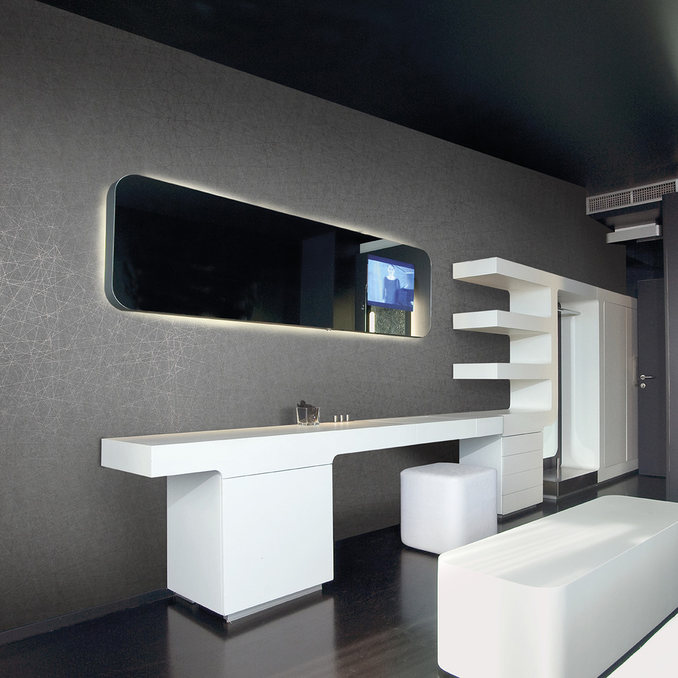 Modelo de dormitorio principal minimalista de tamaño medio sin chimenea con paredes grises y suelo de linóleo