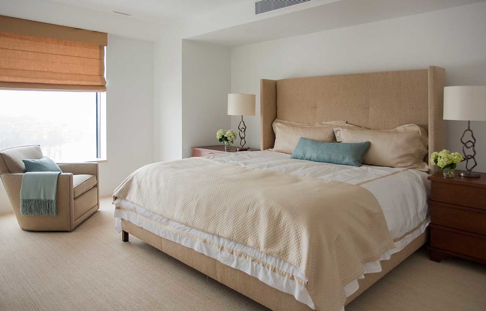 Photo of a large contemporary master bedroom in Boston with white walls and carpet.