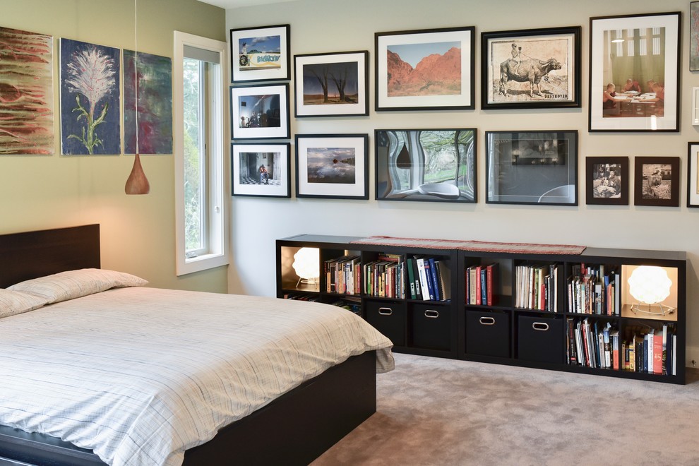 Inspiration for a contemporary master bedroom in Portland with green walls, carpet and grey floors.