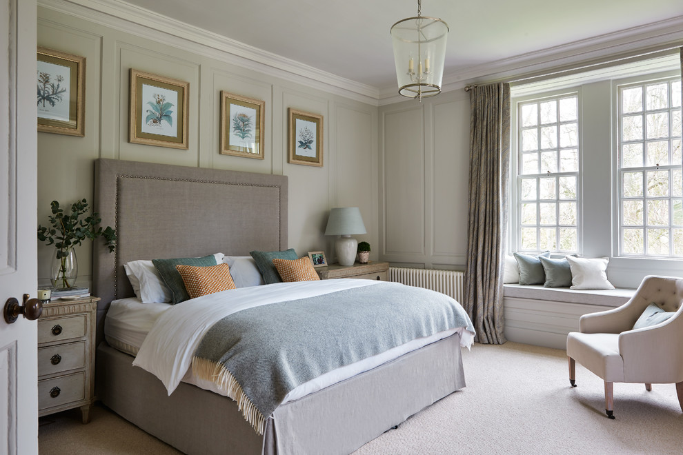 Inspiration for a beach style master bedroom in Wiltshire with grey walls, carpet and beige floors.