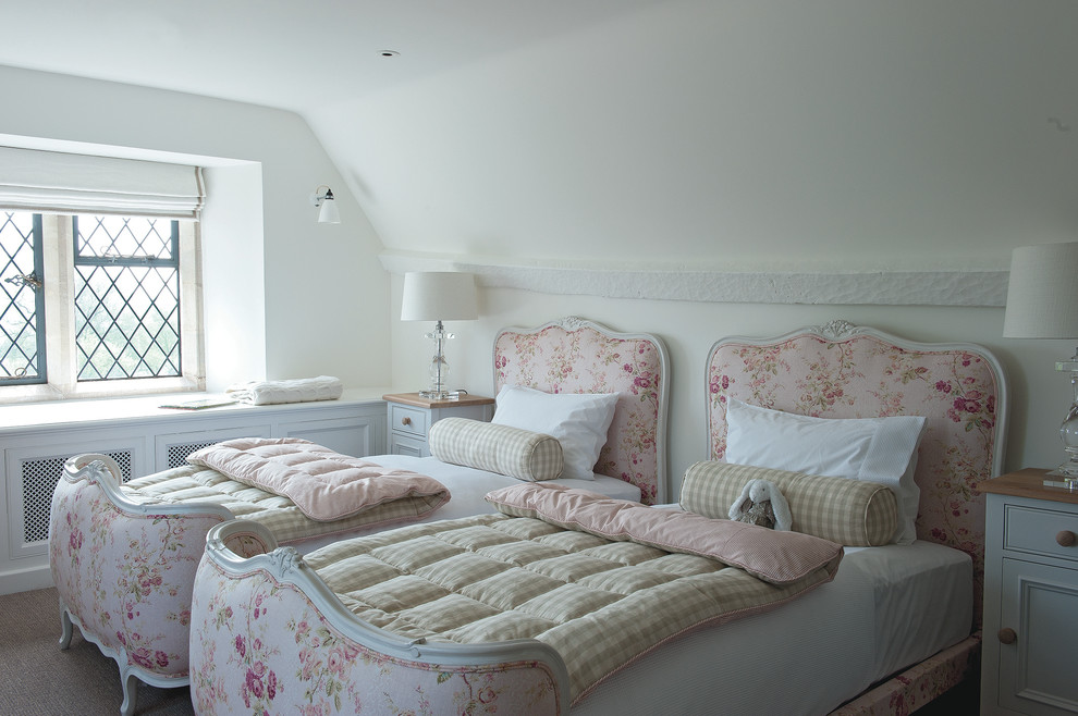 Mid-sized elegant guest carpeted bedroom photo in Gloucestershire with white walls