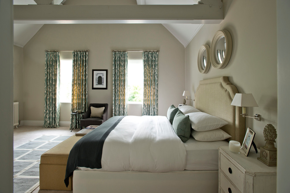 Design ideas for a contemporary master bedroom in Gloucestershire with beige walls.