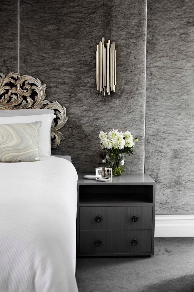 This is an example of a contemporary grey and silver bedroom in Melbourne.