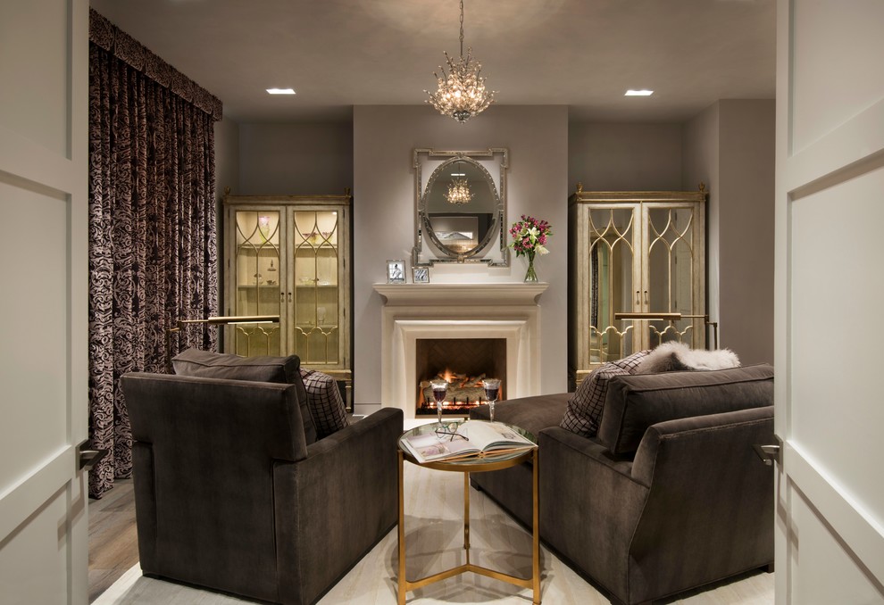 Inspiration for a large contemporary master bedroom in Phoenix with grey walls, dark hardwood flooring, a standard fireplace, a stone fireplace surround and brown floors.