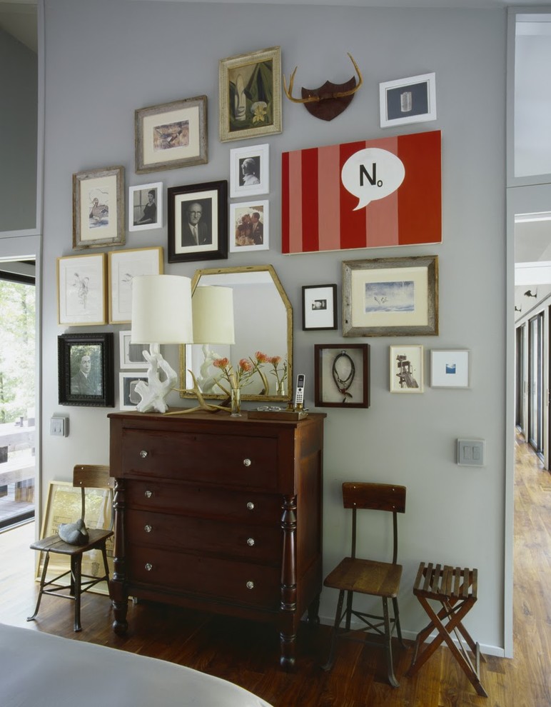 Inspiration for an eclectic bedroom remodel in New York with white walls