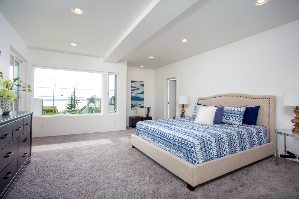 Inspiration for an expansive modern master bedroom in Seattle with white walls, carpet and no fireplace.