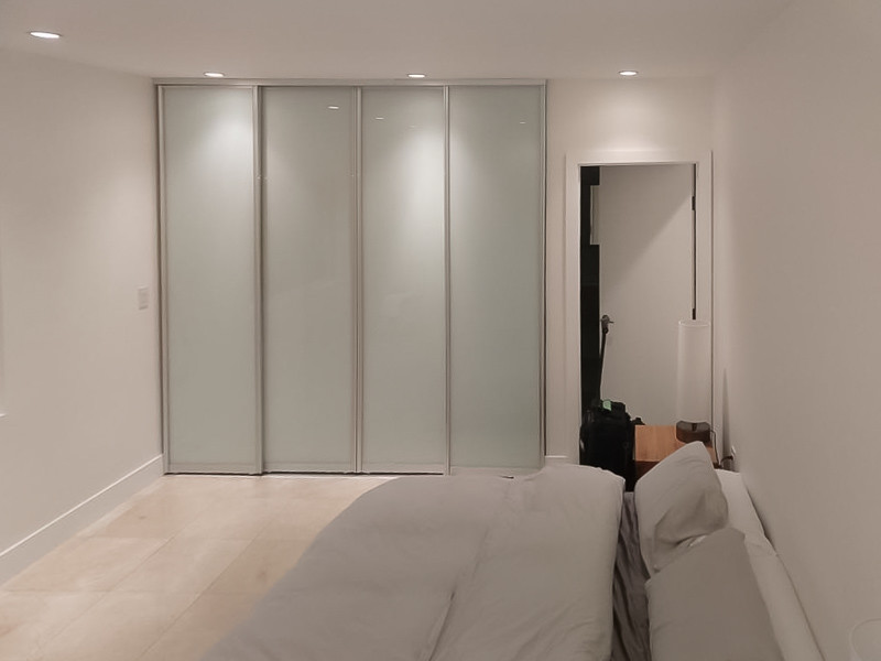 Example of a large minimalist master bedroom design in Miami