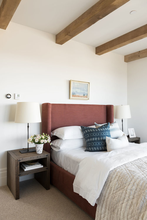 Inspiration for a large classic guest bedroom in Salt Lake City with white walls, carpet and beige floors.