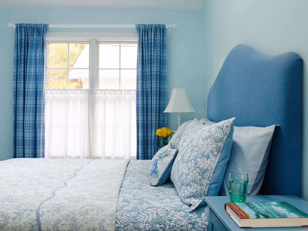 Inspiration for a coastal bedroom remodel in Chicago with blue walls