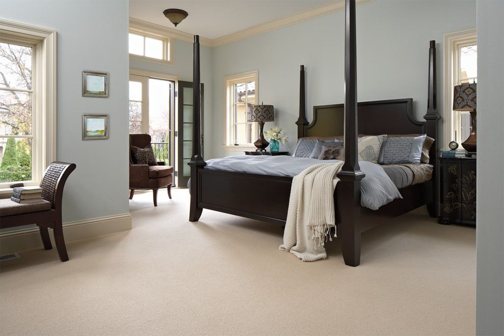 Inspiration for a large transitional master carpeted and beige floor bedroom remodel in Charleston with blue walls and no fireplace