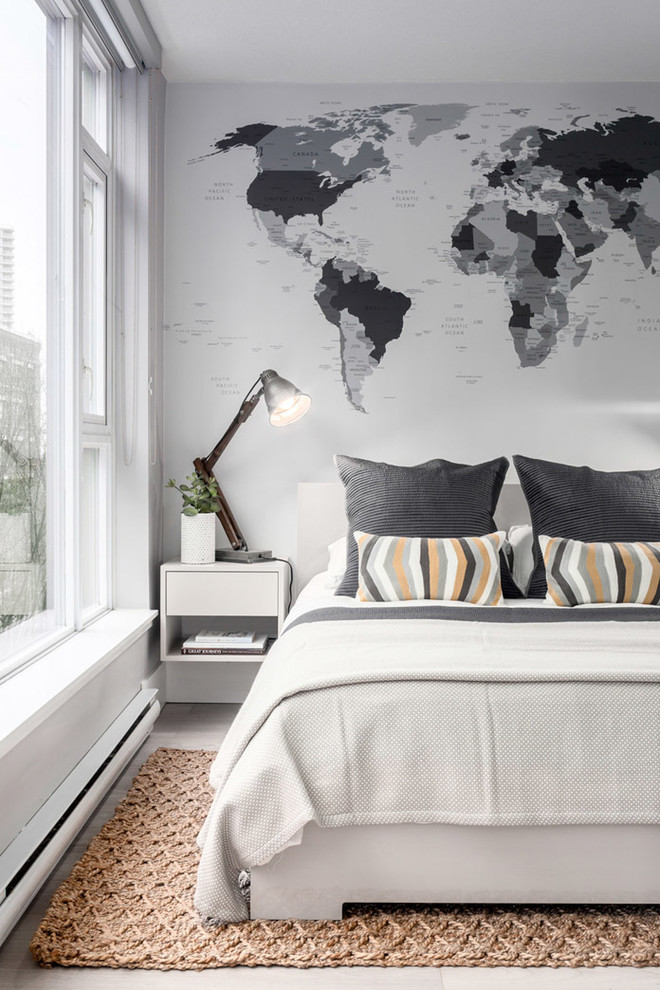 Example of a small trendy master light wood floor bedroom design in Vancouver with gray walls and no fireplace
