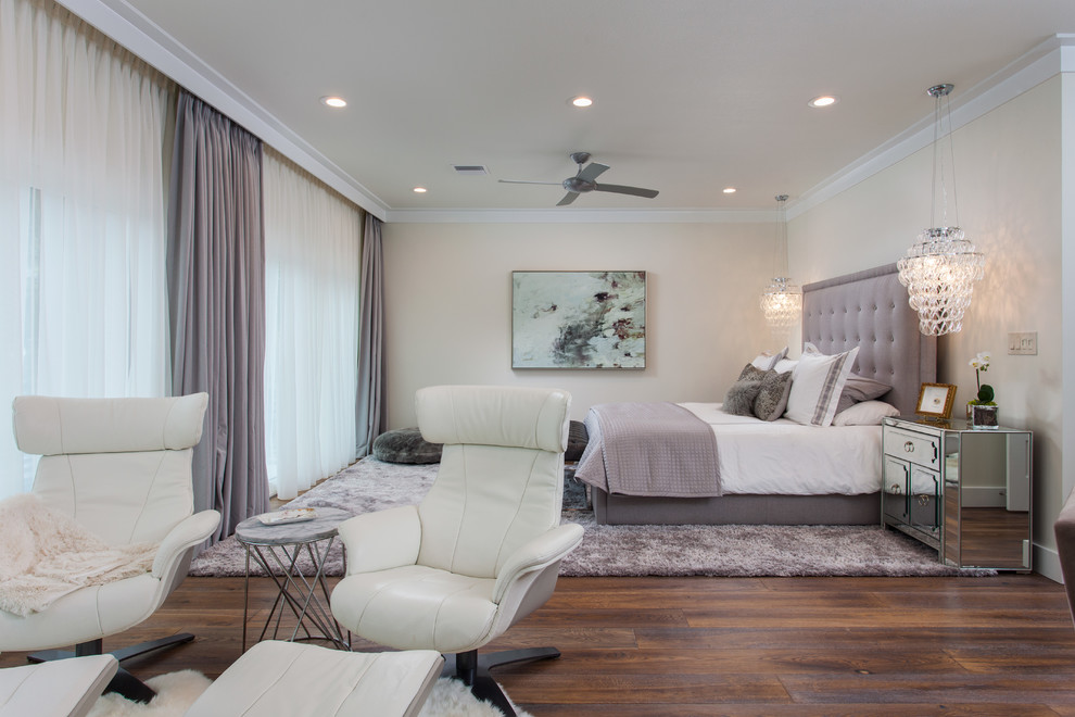 Example of a huge minimalist master medium tone wood floor and brown floor bedroom design in Tampa with white walls