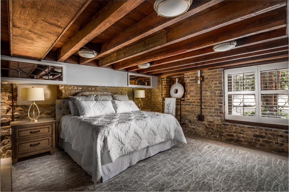 Imagen de dormitorio urbano con suelo gris