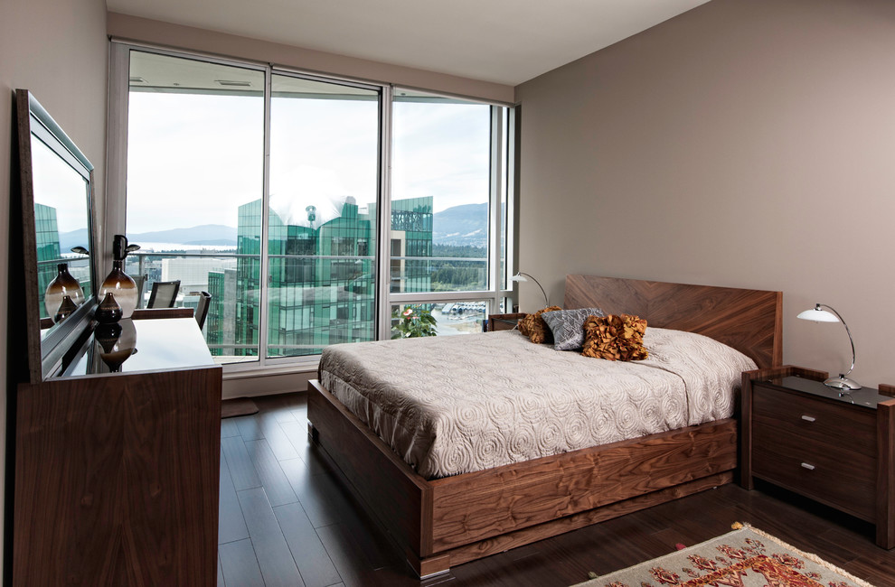 Inspiration for a medium sized contemporary bedroom in Vancouver with beige walls, dark hardwood flooring, no fireplace and brown floors.