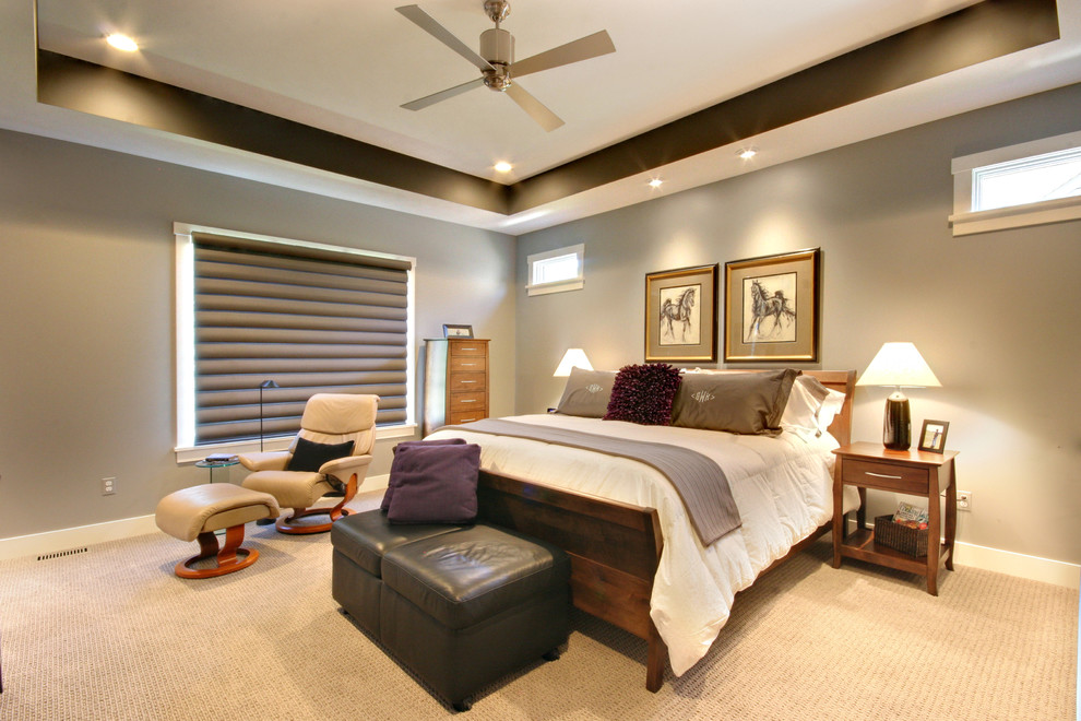 Example of a mid-sized trendy master carpeted and beige floor bedroom design in Grand Rapids with gray walls and no fireplace