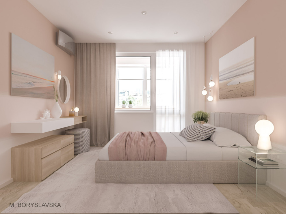 Immagine di una piccola camera matrimoniale minimal con pareti beige, pavimento in laminato e pavimento beige