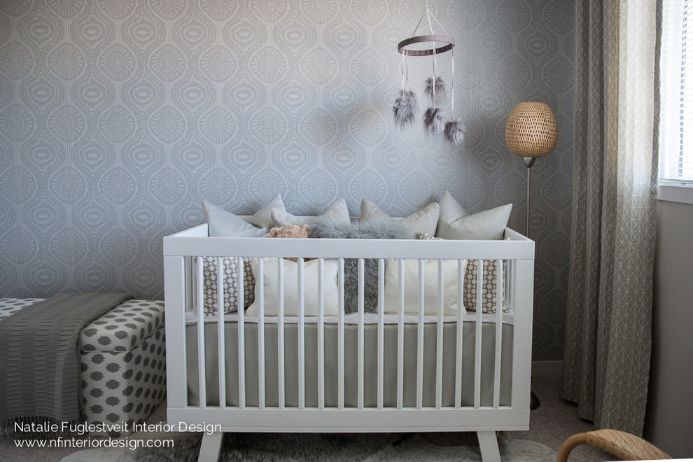 This is an example of a small modern nursery in Calgary with grey walls and carpet.