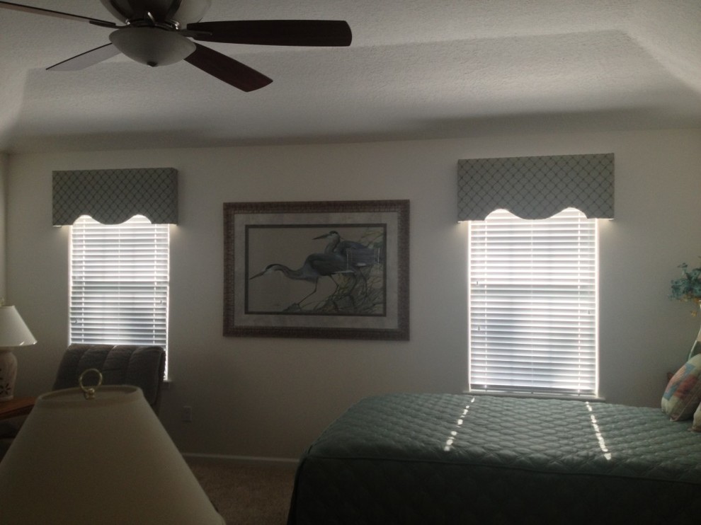 Large elegant master bedroom photo in Jacksonville with white walls