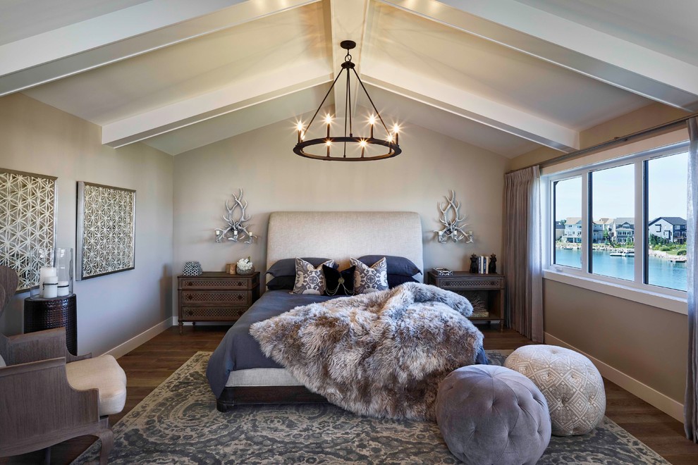 Inspiration for a classic master bedroom in Calgary with beige walls and dark hardwood flooring.