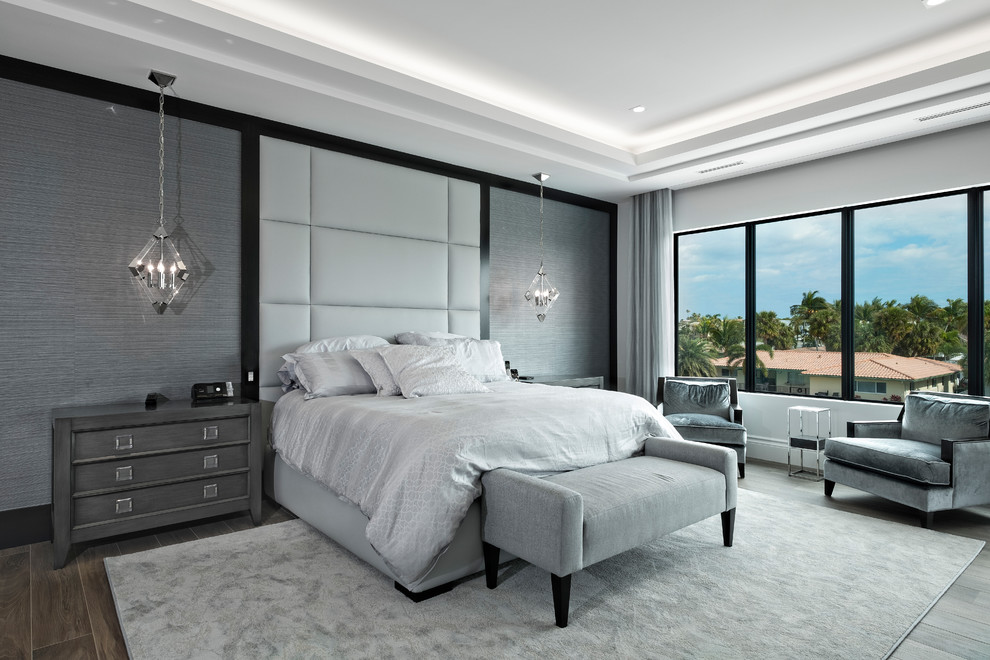 Example of a trendy master bedroom design in Miami with gray walls