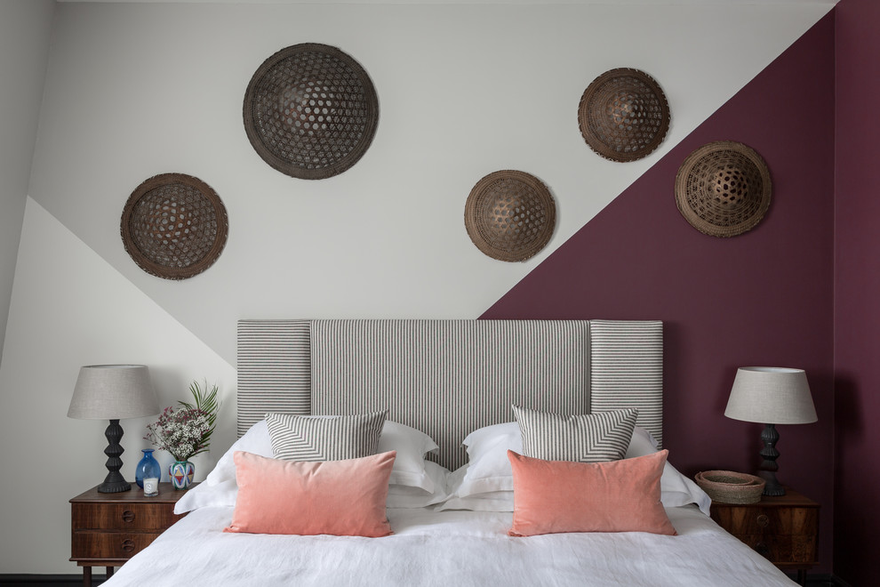 Inspiration for a contemporary bedroom in London with purple walls.