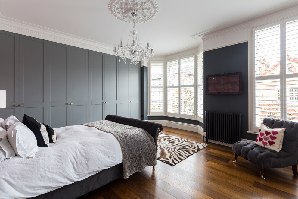 Inspiration for a contemporary grey and pink bedroom in London.