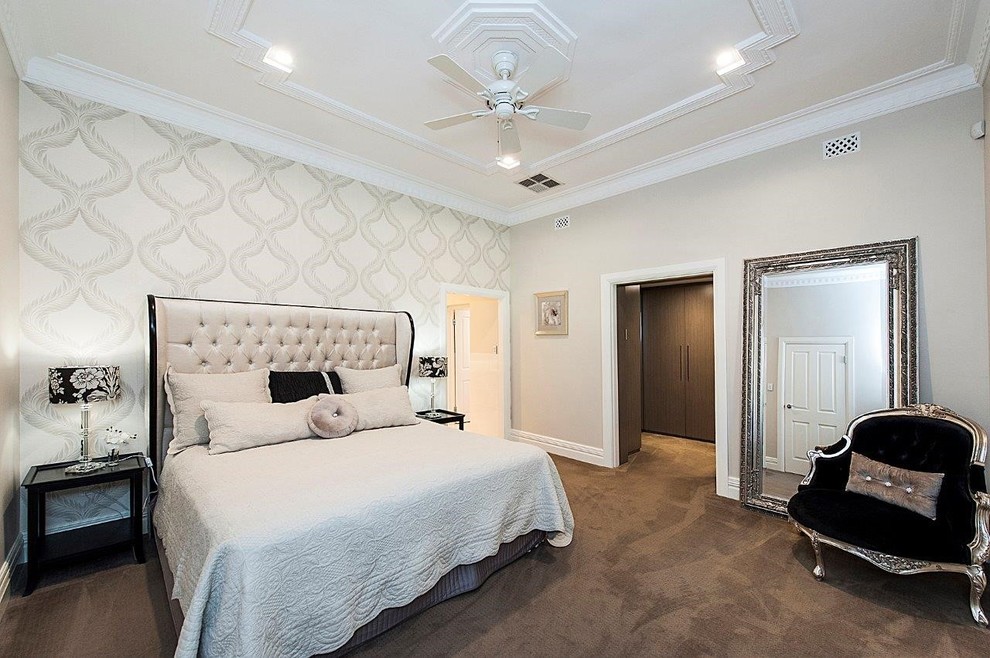Inspiration for a mid-sized timeless master carpeted bedroom remodel in Perth with beige walls