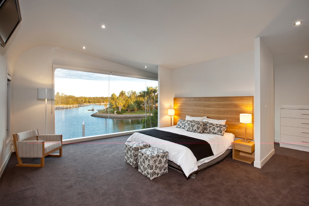 Mid-sized beach style master carpeted and gray floor bedroom photo in Brisbane with white walls