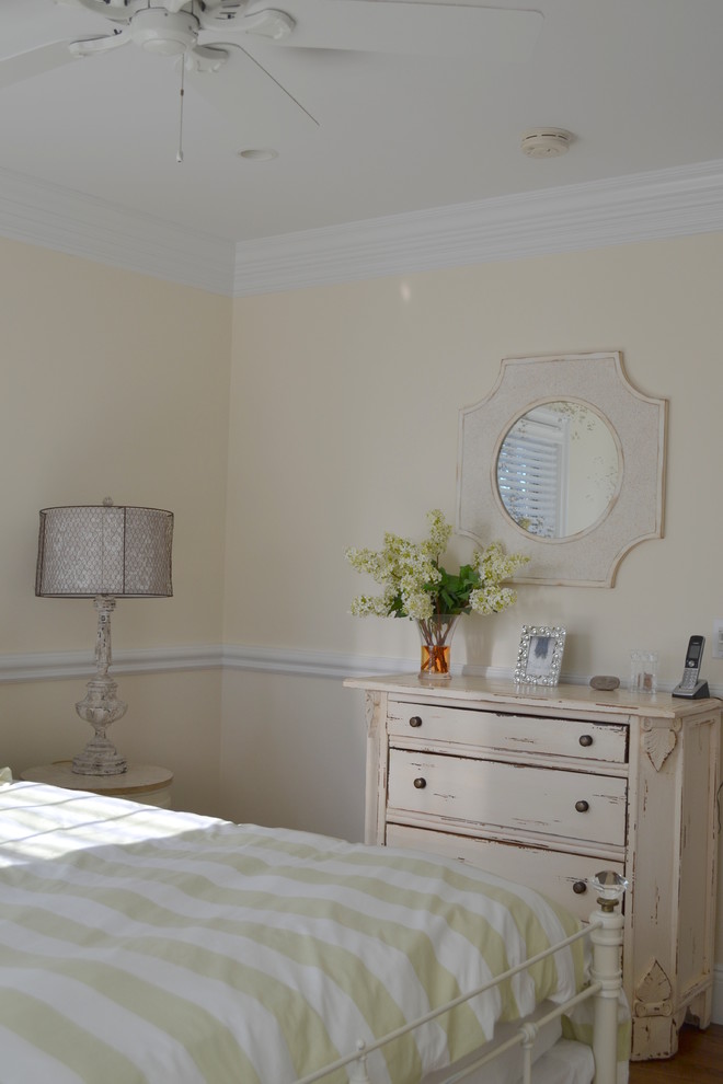 Photo of a medium sized coastal guest bedroom in New York with beige walls, dark hardwood flooring and no fireplace.
