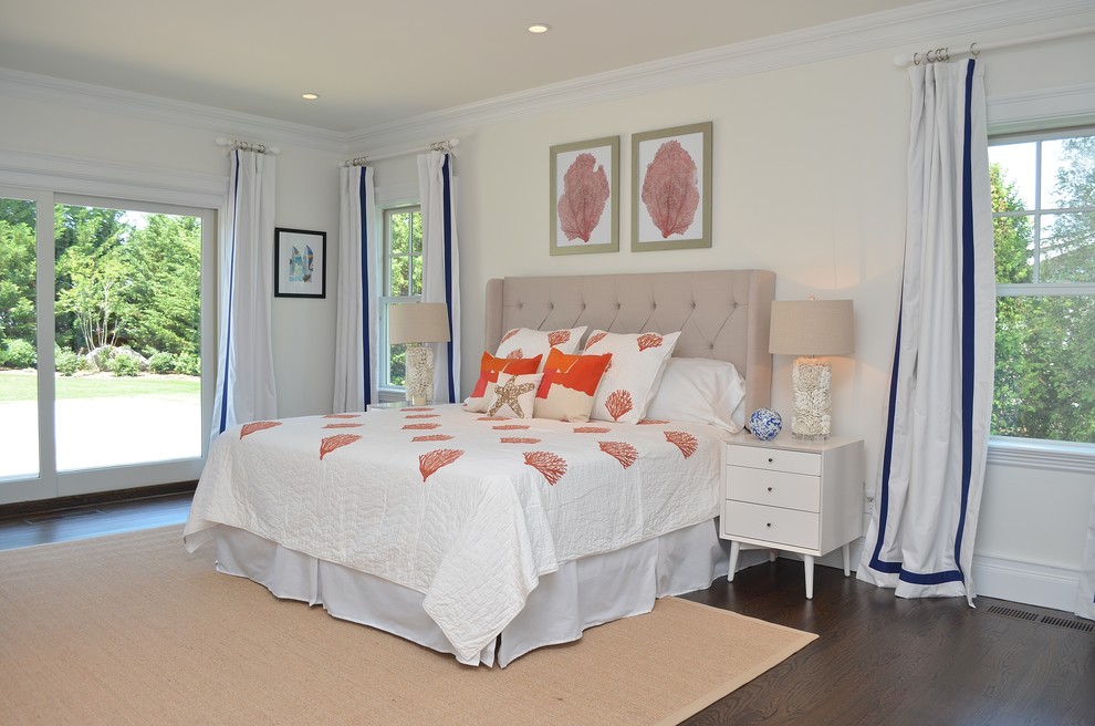 Design ideas for a coastal master bedroom in New York with dark hardwood flooring.