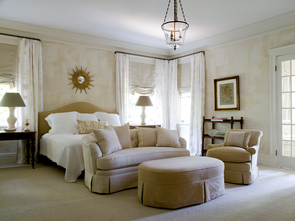 Photo of a large traditional master bedroom in Little Rock with white walls and carpet.
