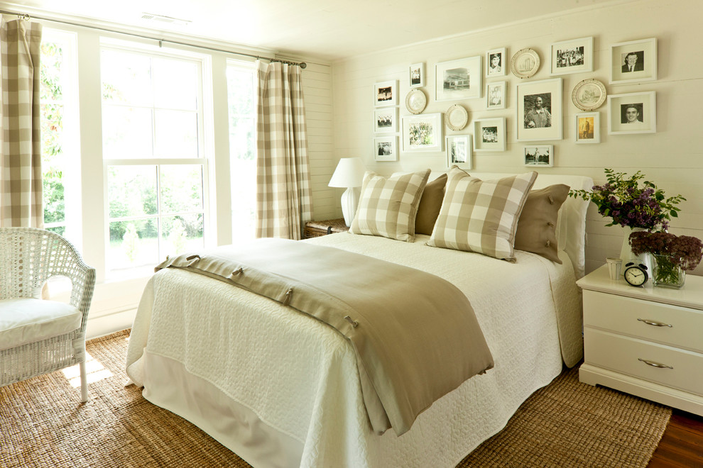 Country dark wood floor bedroom photo in Birmingham with beige walls